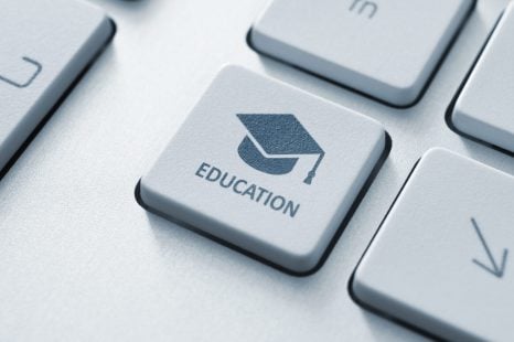 Button,With,Graduation,Cap,Icon,On,A,Modern,Computer,Keyboard.